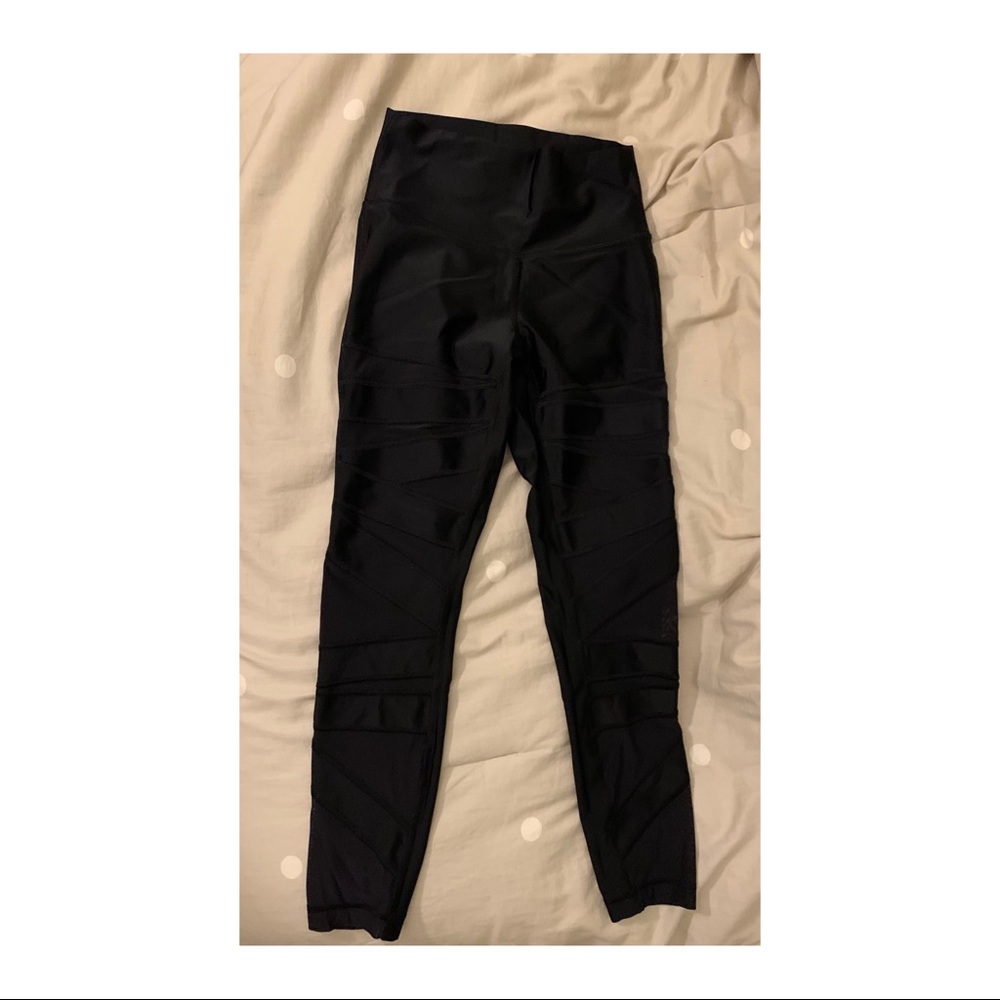 Black Lulu Lemon leggings with mesh cutouts